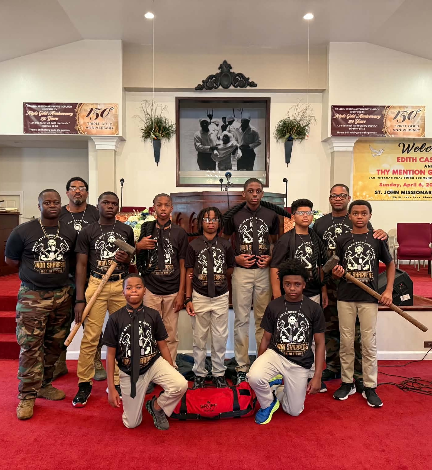 Young men and mentors of Iron Sharpens Iron Mentoring Foundation gathered at St. John Missionary Baptist Church